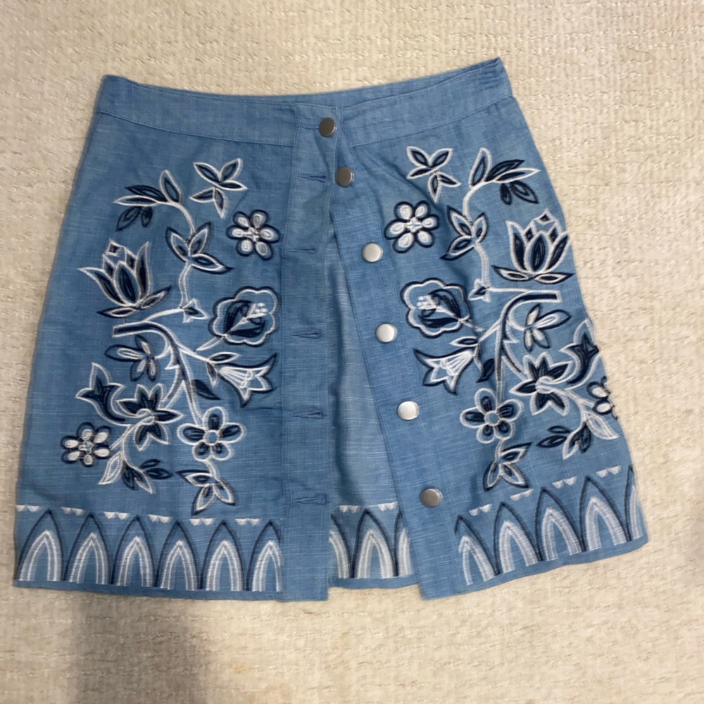 Adorable embroider button up skirt.